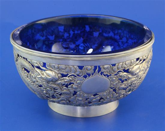 A late 19th century Chinese silver circular bowl with blue glass liner, 11 oz.